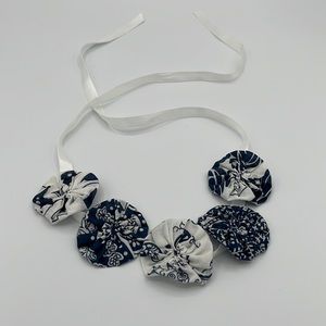 Ribbon necklace with blue and white cloth flowers